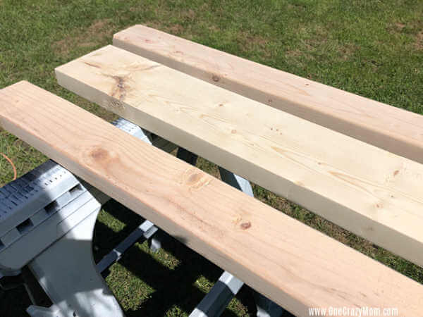 Boards on a sawhorse ready to cut.