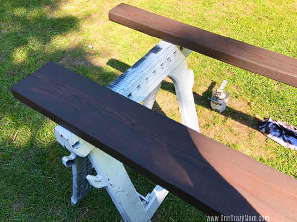Stain brushed on to boards.
