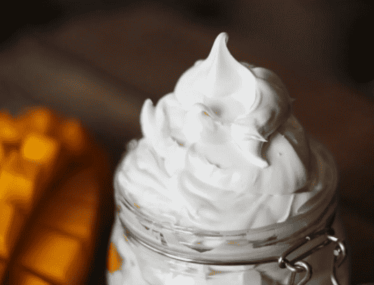 Mango body butter in a jar.