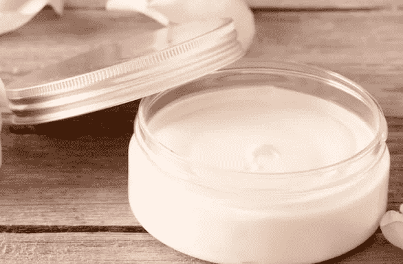 Lotion in jars with the top off.