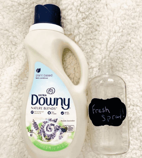 Bottle of Downy and spray bottle.