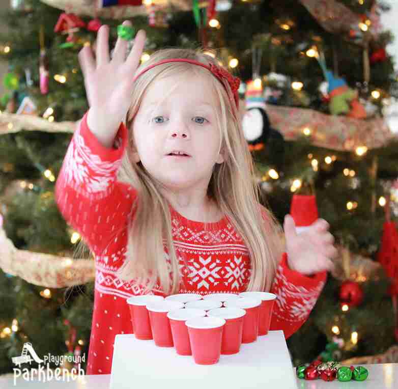 Jingle Bell Toss game with child playing.