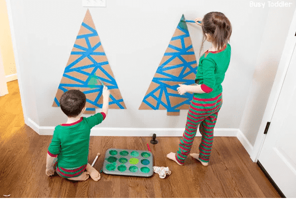 Christmas tree tape activity on wall.