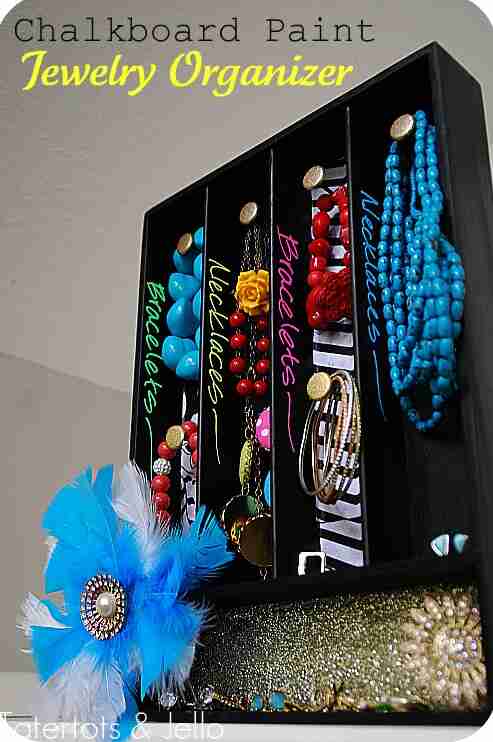 Silverware tray hanging with jewelry.
