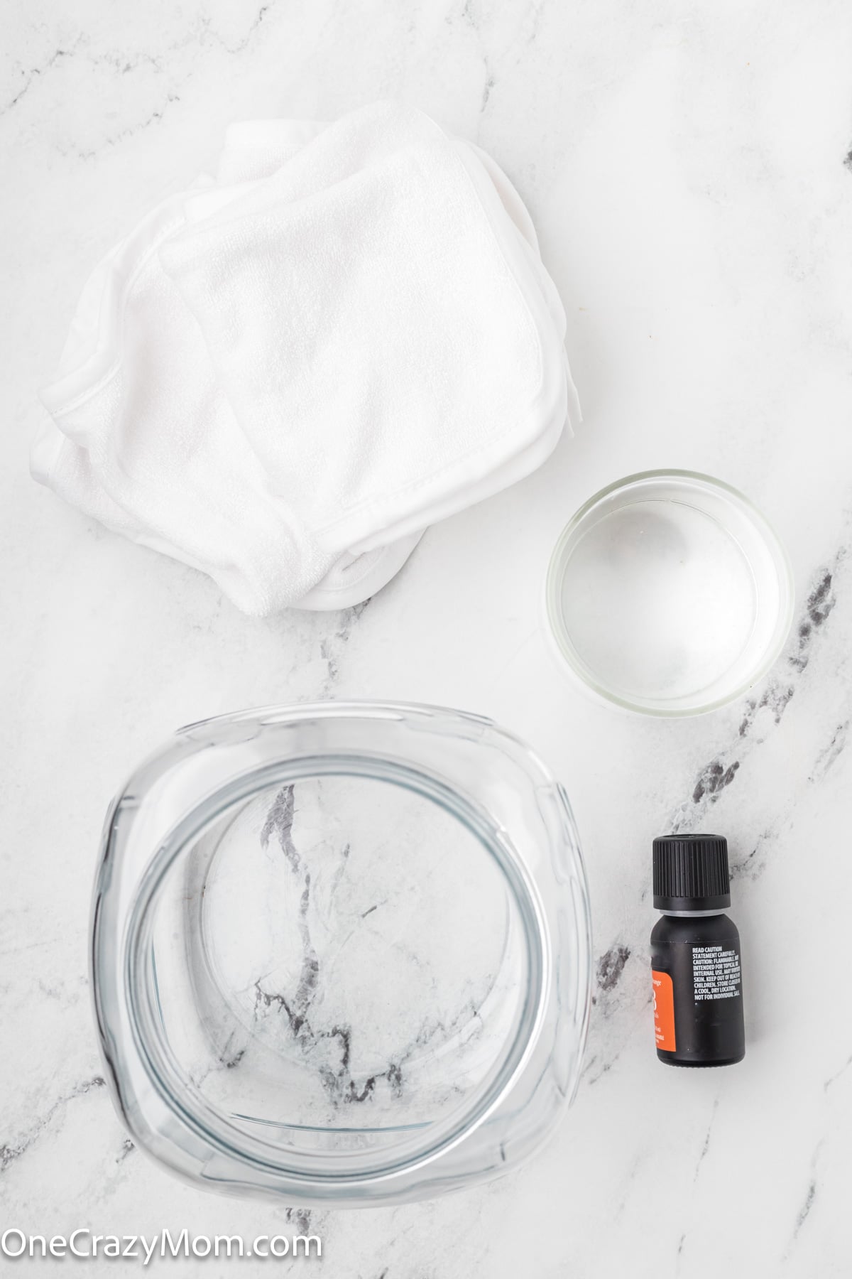 supplies for homemade dryer sheets- jar, vinegar, essential oils, pillowcase or rags, pinking shears.