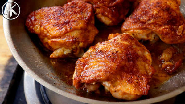 You will love these Keto Chicken Thigh Recipes if you are eating ketogenic. They are simple and delicious. The entire family will love keto chicken thighs. chicken thighs in a pan on the stove.