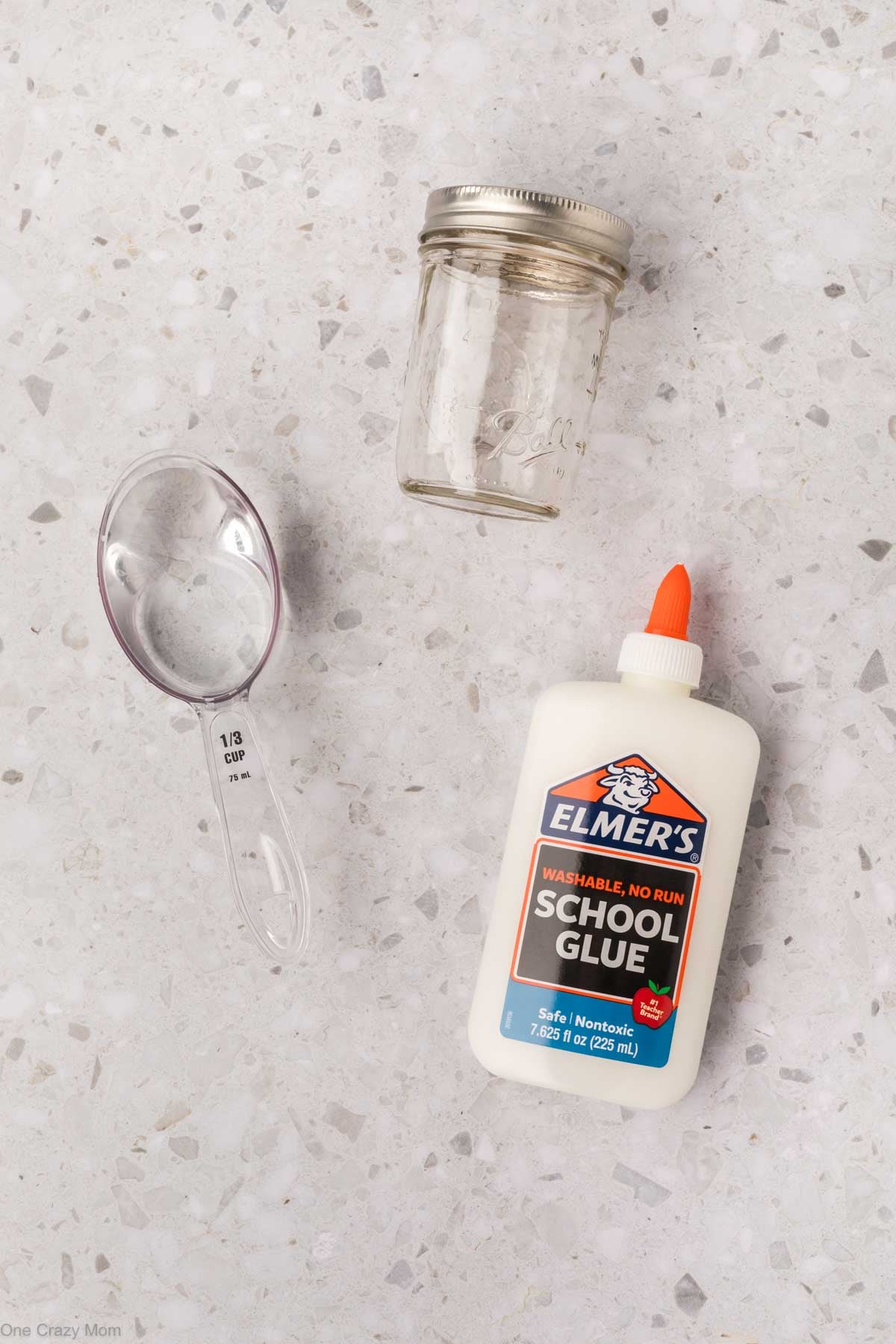 Supplies for Mod Podge- glue, jar and water.