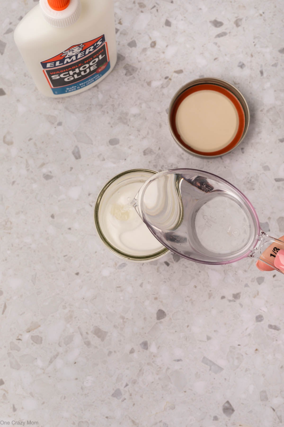 Water poured into glue in the jar.