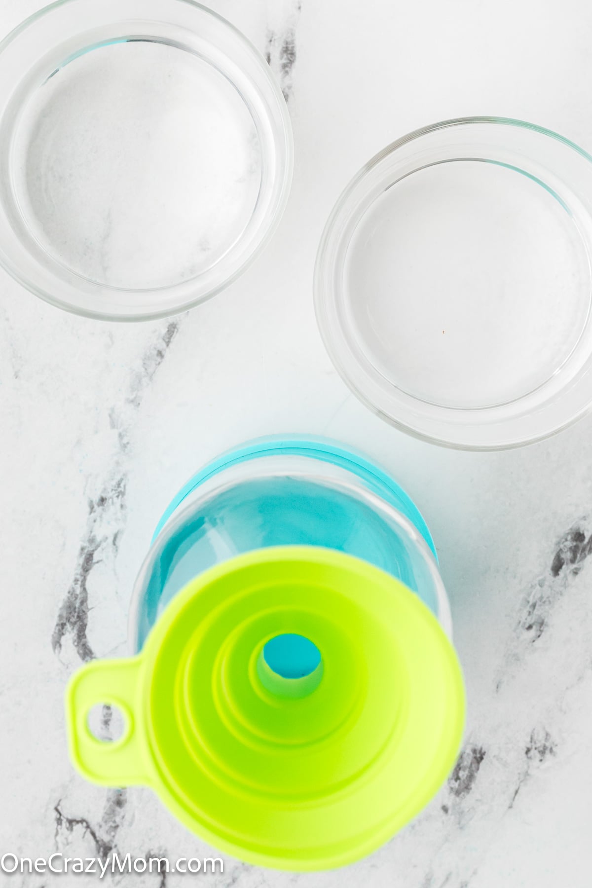 Funnel in spray bottle and rubbing alcohol added.
