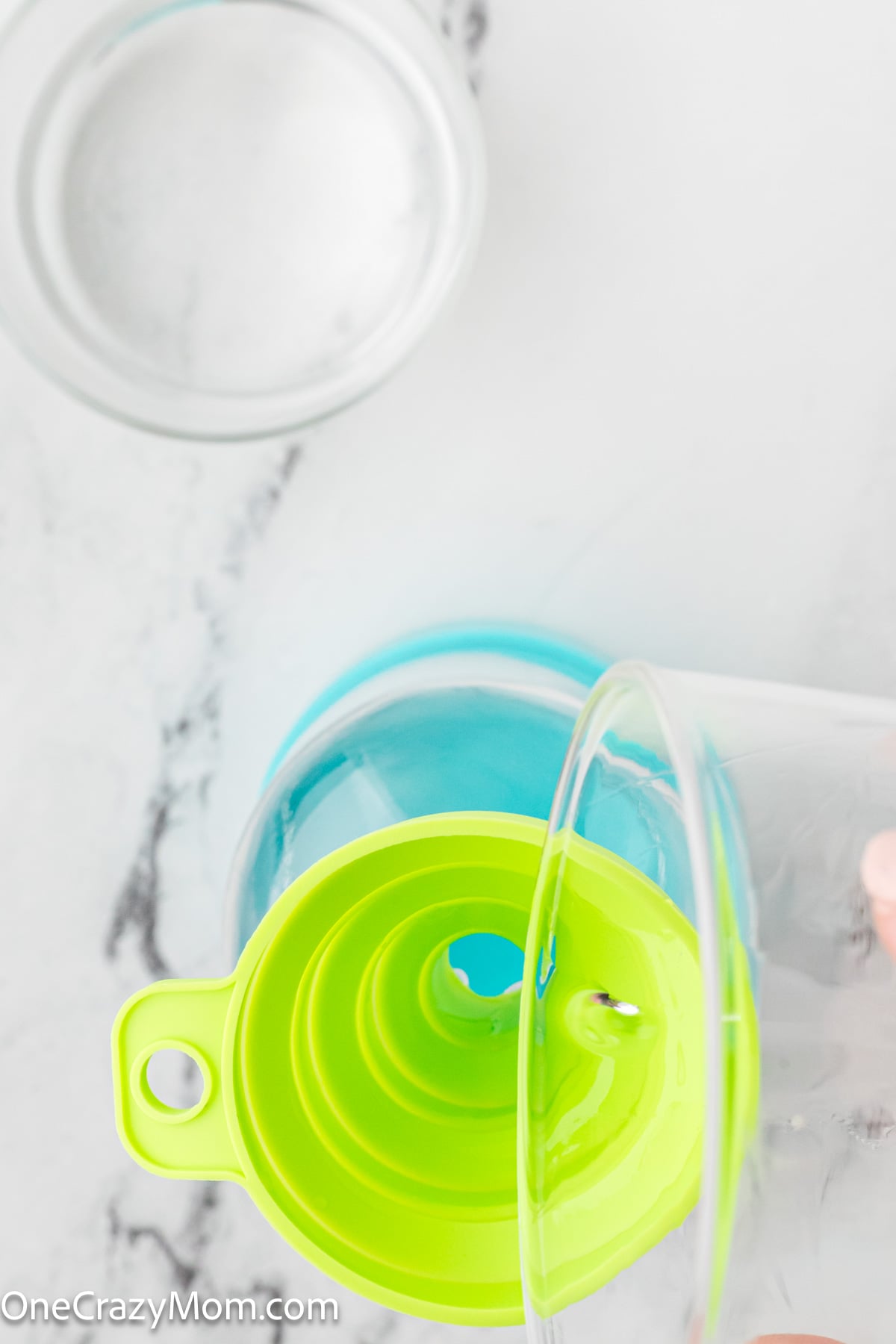 Vinegar added in funnel into the spray bottle.