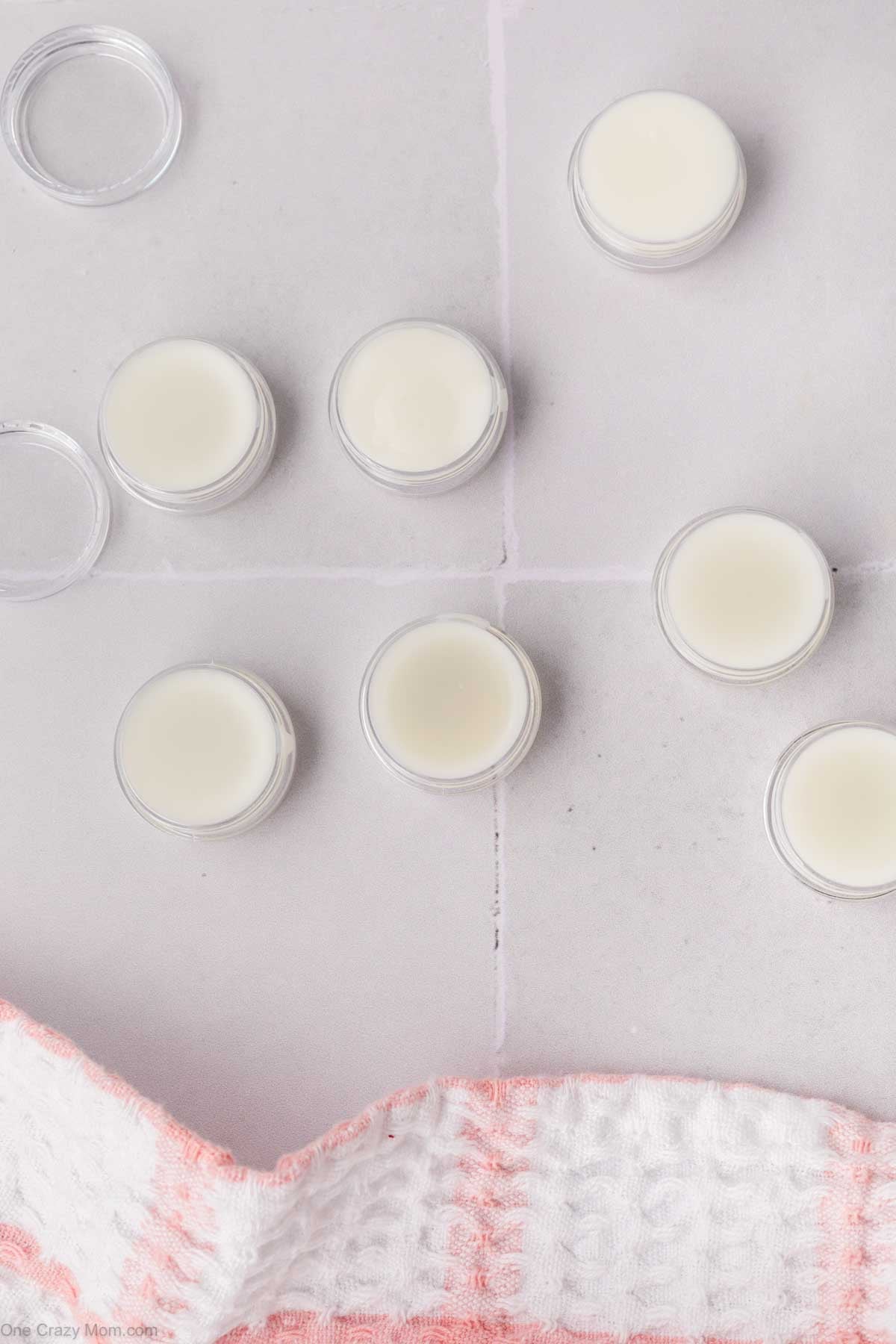 Containers of lip balm.