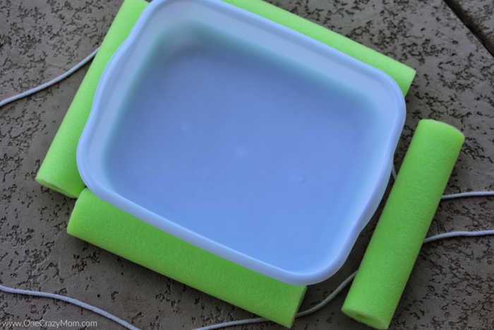 Pool noodle pieces around plastic bin.