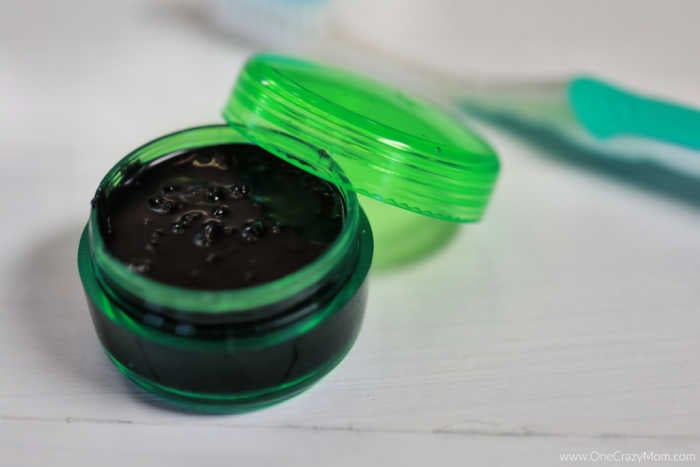 Charcoal mixture in container.