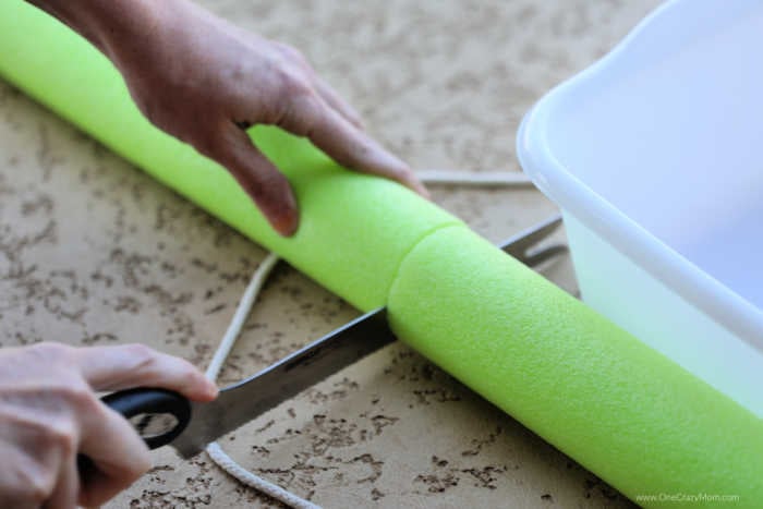 Pool noodle being cut.