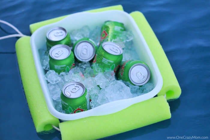 Drinks in cooler floating in the pool