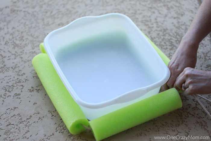 Pool noodles on each side of bin.