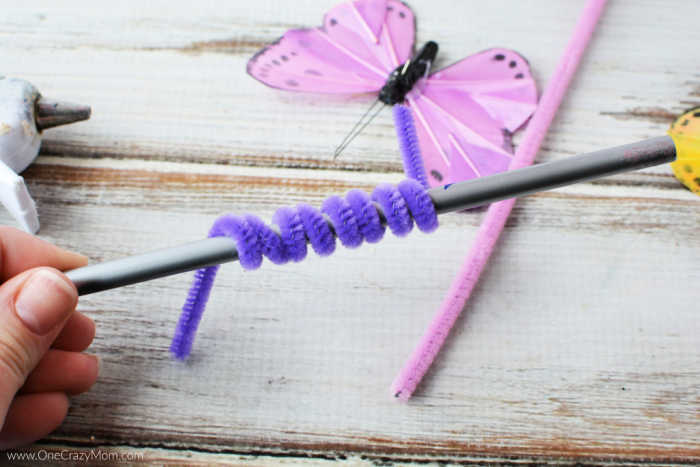 Pipe cleaner around a pencil.