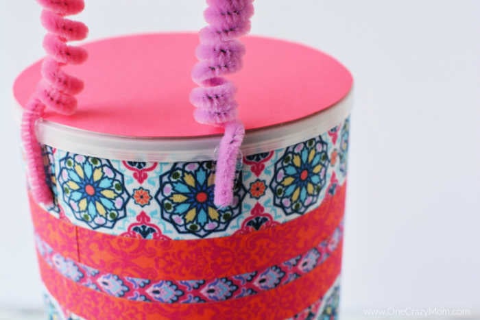 Butterflies attached to container.