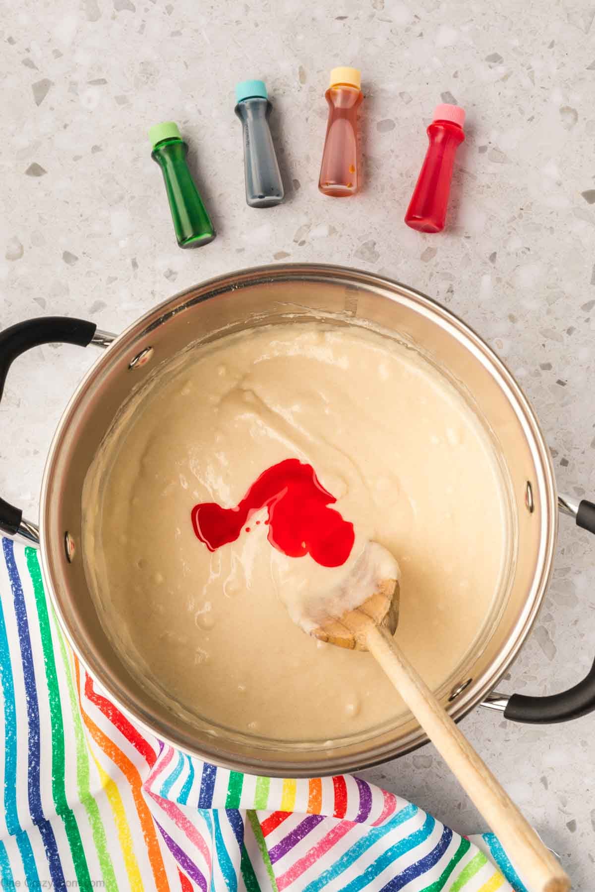 Food coloring dropped into mixture.