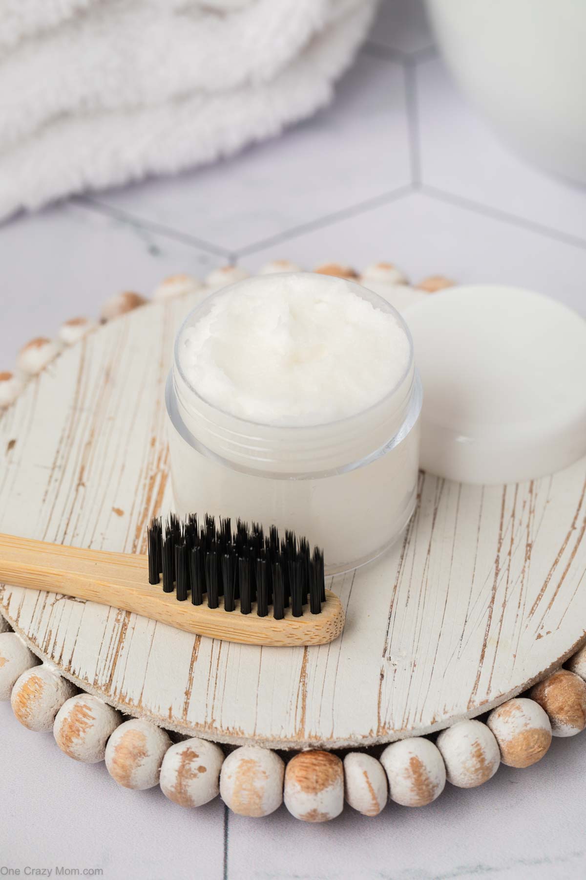 DIY teeth whitening paste beside a toothbrush.