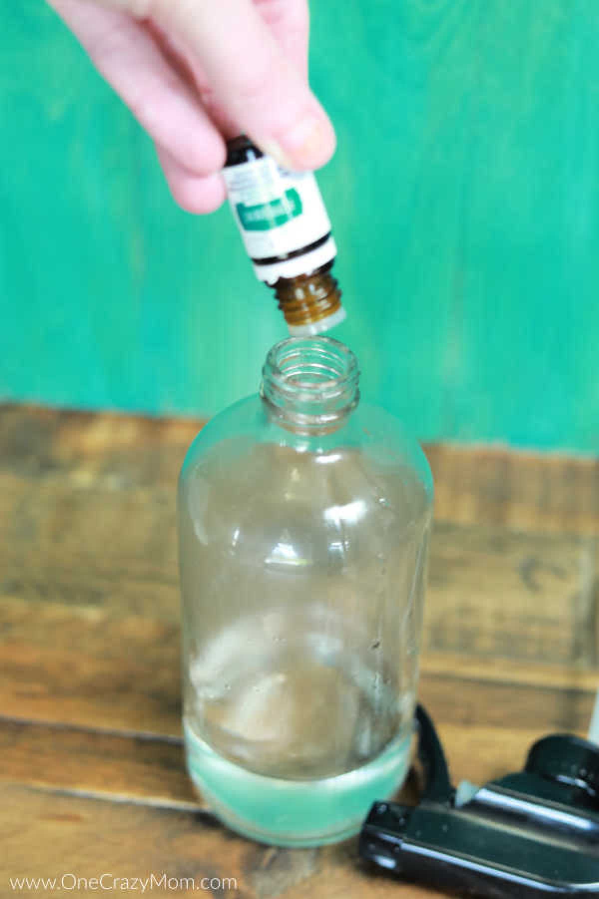 Essential oils poured into bottle.