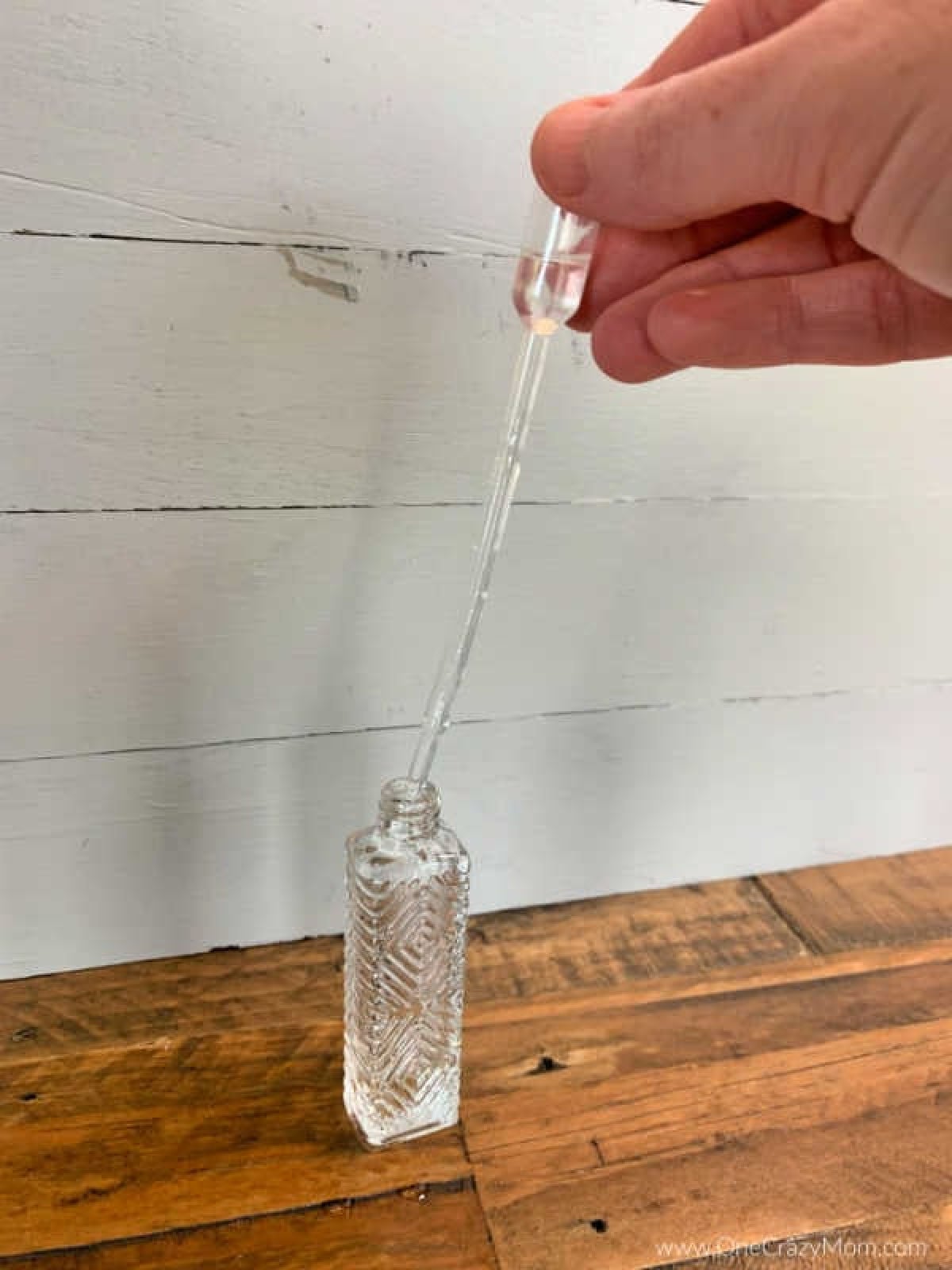 Coconut oil poured into perfume bottle.