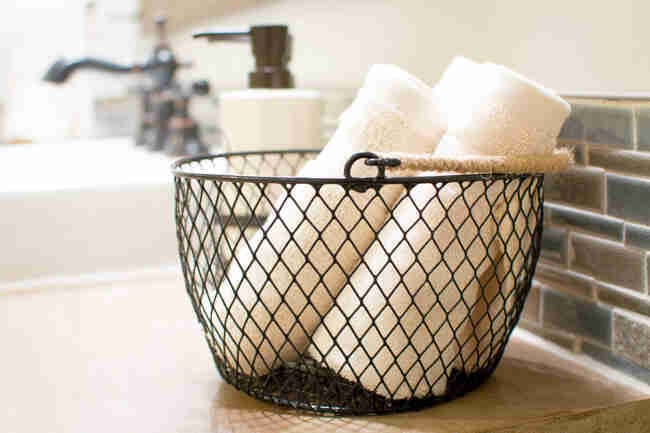 Wire basket with washcloths.