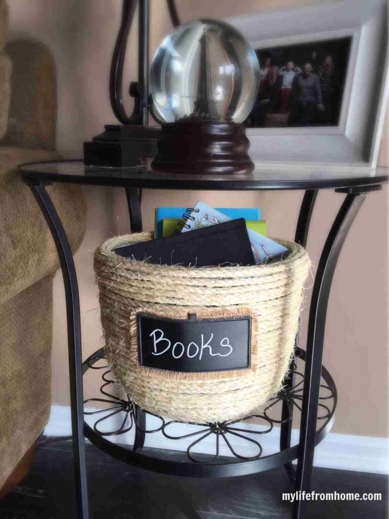 Rope basket with books.