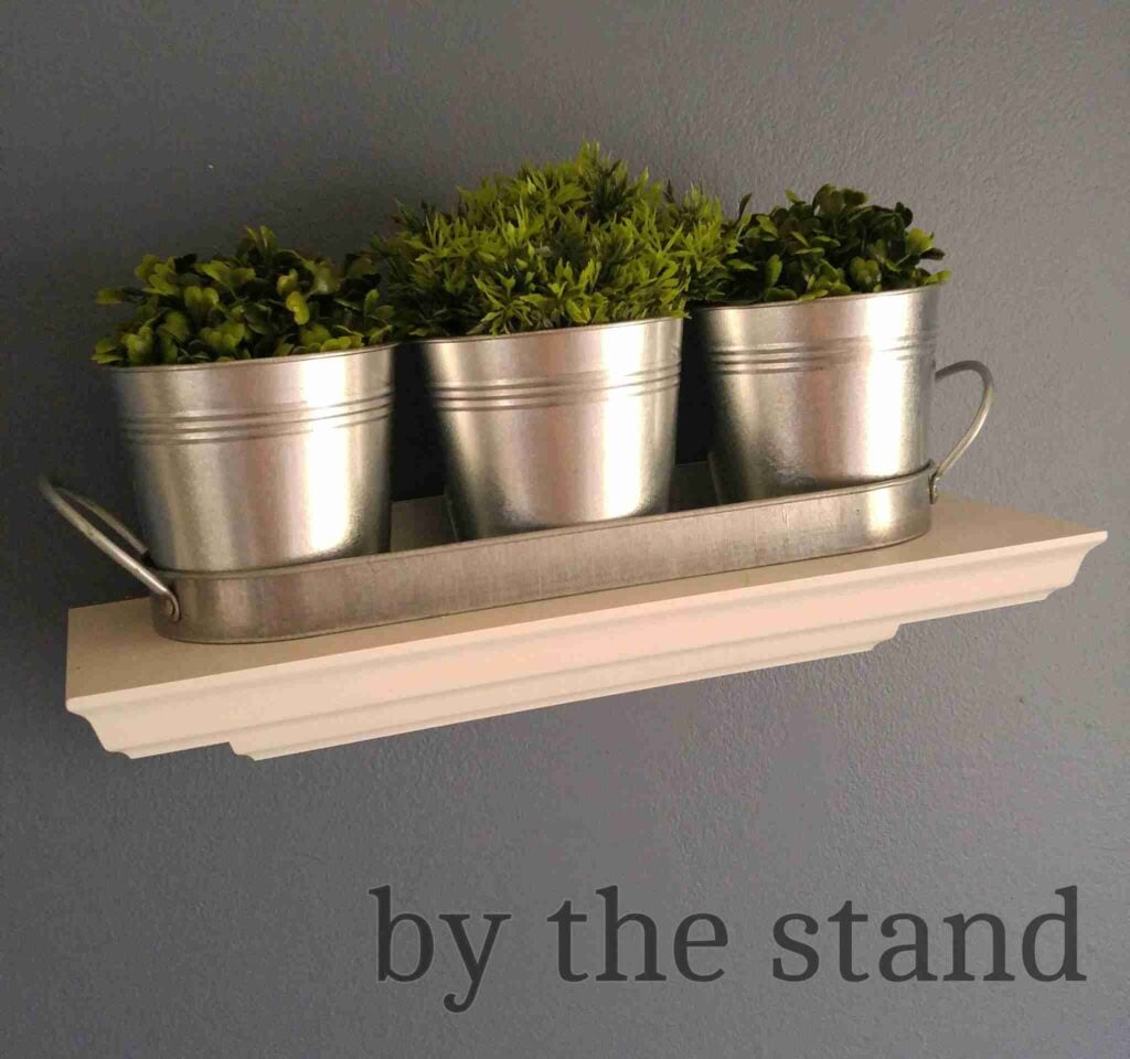 Planters on wall shelf.