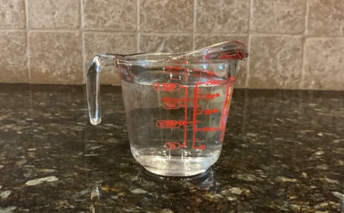 Vinegar in measuring cup.