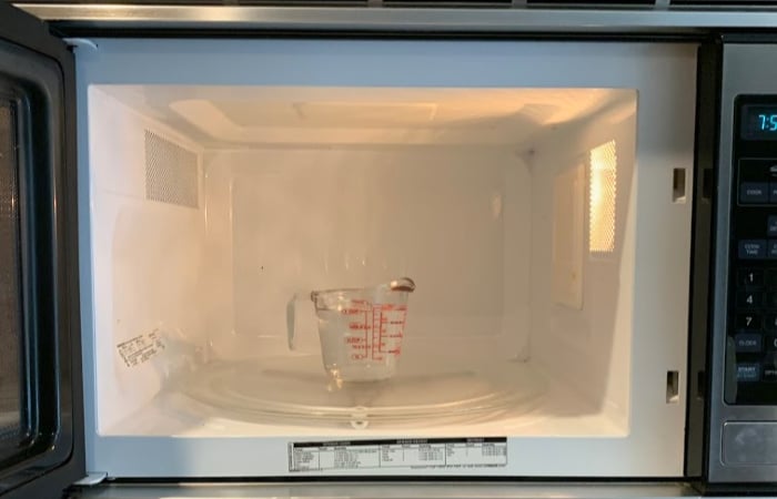 Measuring cup in microwave.