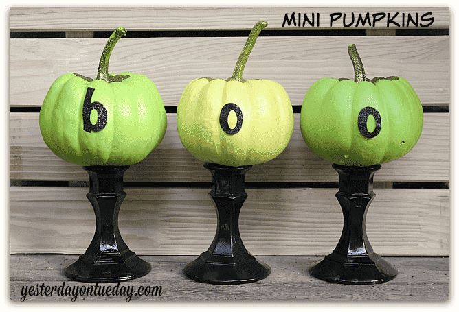 Mini pumpkins with boo letters.