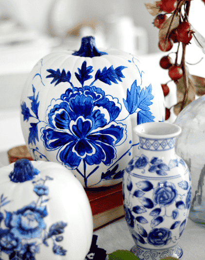 Blue porcelain pumpkin on table.