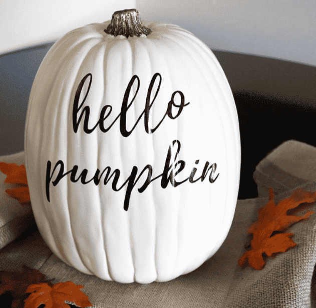 White pumpkin with hand lettered pumpkin.