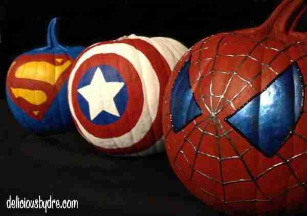 Superhero pumpkins stacked together.