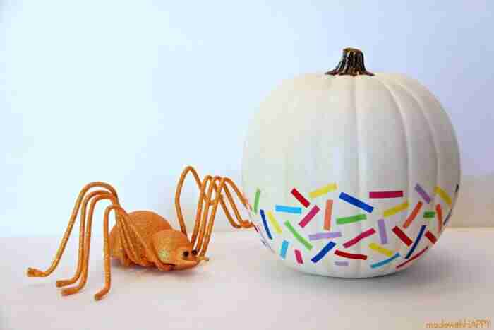 White pumpkin with colorful tabs.