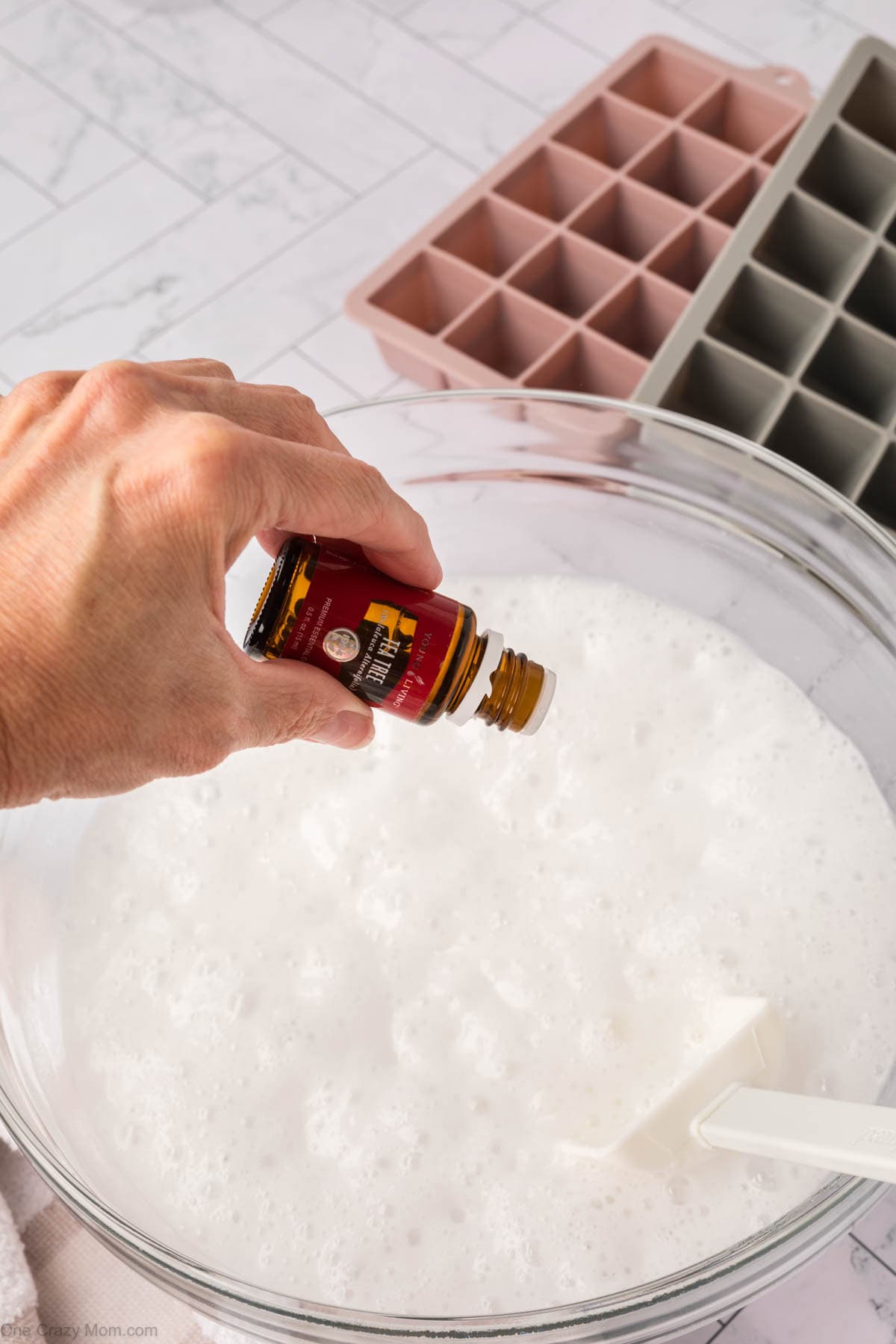 Essential oils dropped into mixture.
