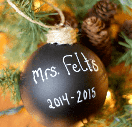 Chalkboard ornament on tree.
