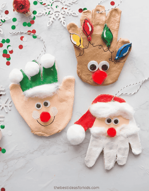 Handprint ornament decorated as elves, snowman and Santa.