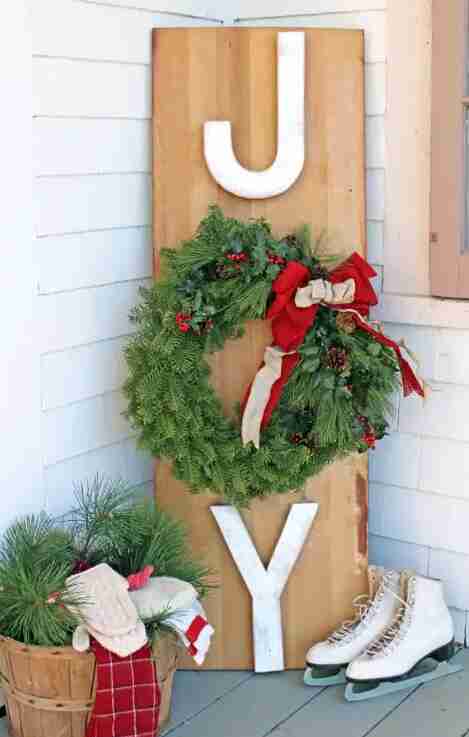 Joy outdoor sign with wreath.