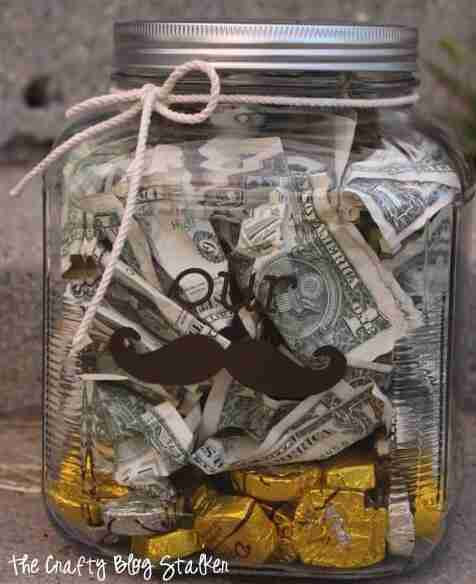 Money jar with cash and candy.