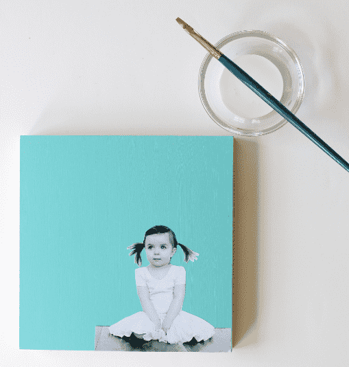 Photo beside a paint brush.