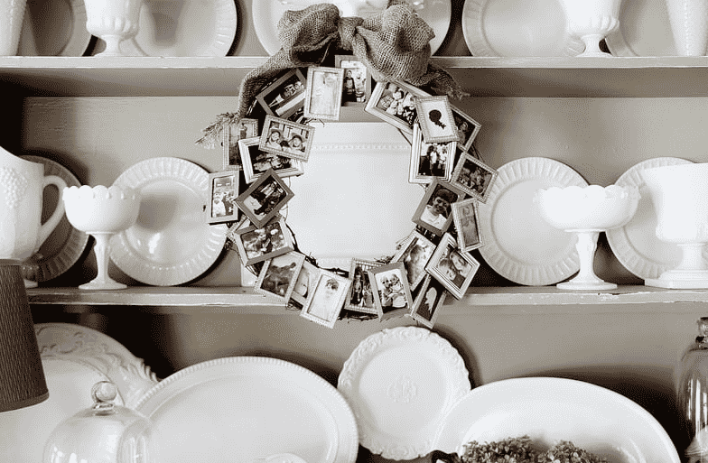 Memory wreath hanging on cabinet.