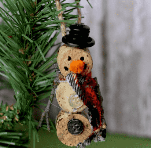 Wine corn snowman on tree.
