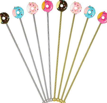 Coffee stirrers with donuts on top.
