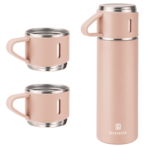 Thermos with cups beside it.
