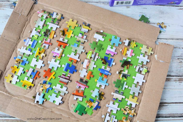 Puzzle pieces arranged on box ready to paint.