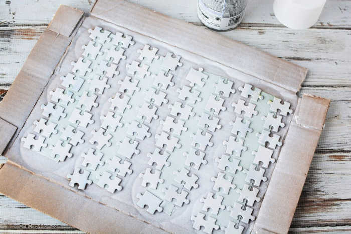 Puzzle spray painted white.