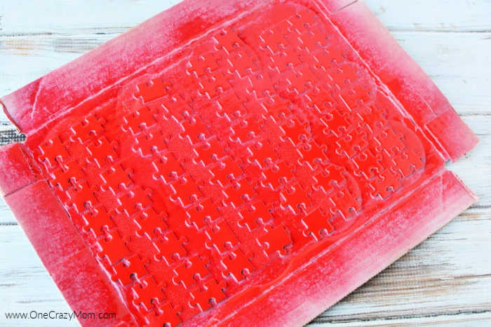 Puzzle spray painted red.