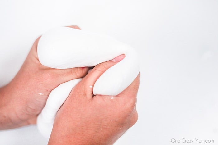 Slime being stretched in hands.